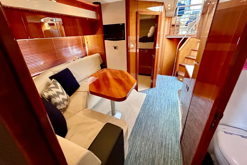 Casa Sul Mare Yacht Photos Pics Luxurious interior of 2010 Sunseeker Predator 64 yacht with elegant seating and wooden finishes.