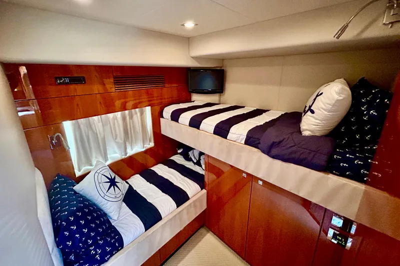 Casa Sul Mare Yacht Photos Pics Bunk beds in 2010 Sunseeker Predator 64 yacht cabin with nautical-themed decor.