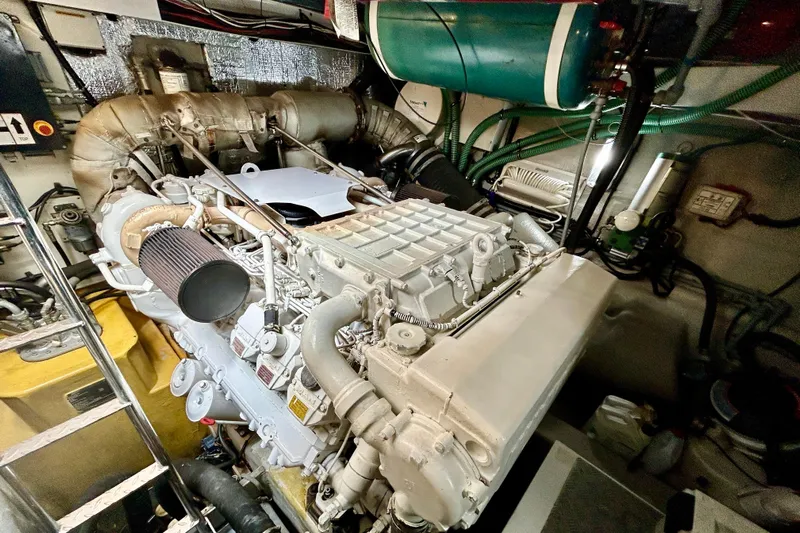 Casa Sul Mare Yacht Photos Pics Engine room of a 2010 Sunseeker Predator 64 yacht, showcasing mechanical components.