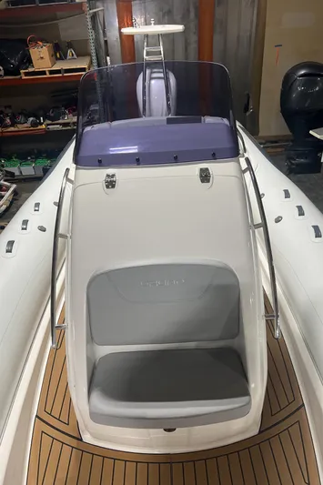  Yacht Photos Pics 2024 Grand Goldenline 850 boat with sleek design and wooden deck accents.