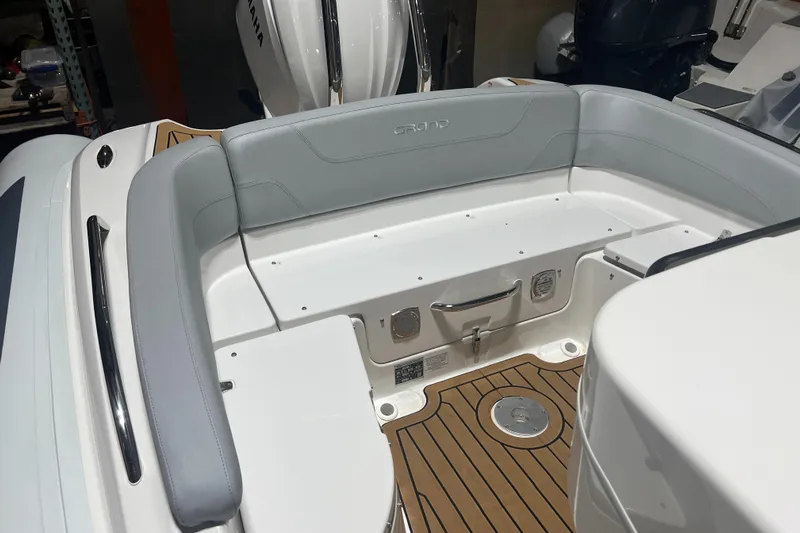  Yacht Photos Pics 2024 Grand Goldenline 850 boat interior with gray seating and teak flooring.