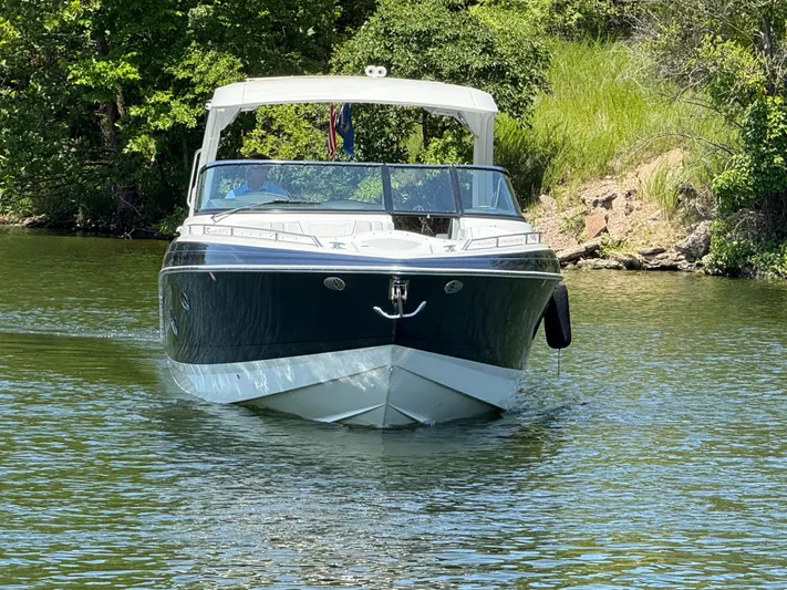  Yacht Photos Pics 2023 Formula 350 Crossover Bowrider I/O cruising on a scenic lake.