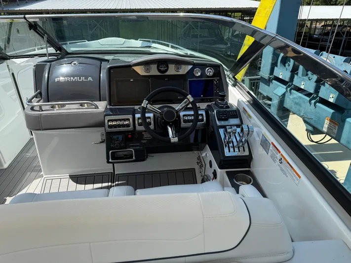  Yacht Photos Pics 2023 Formula 350 Crossover Bowrider I/O helm with modern controls and navigation system.