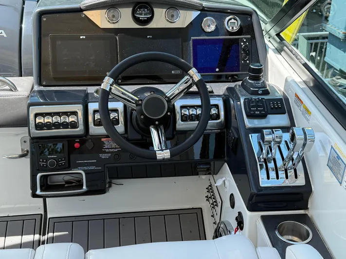  Yacht Photos Pics 2023 Formula 350 Crossover Bowrider I/O dashboard with steering wheel and controls.