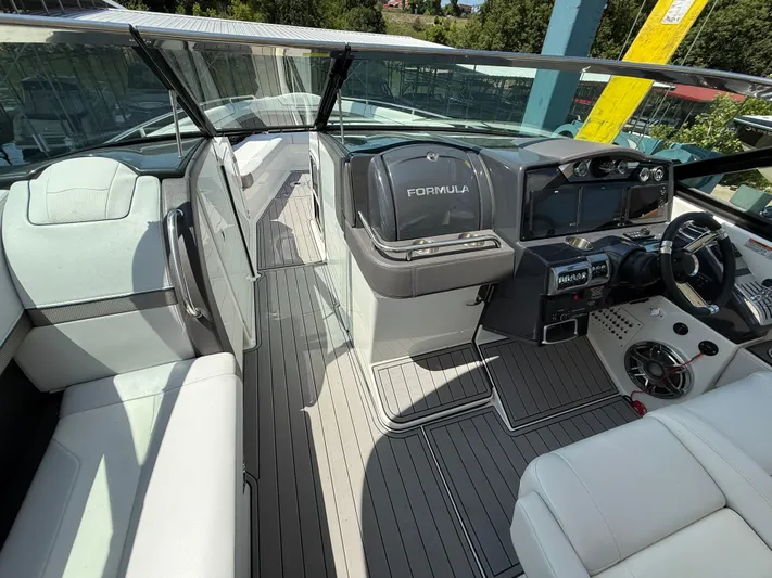  Yacht Photos Pics 2023 Formula 350 Crossover Bowrider I/O interior with sleek dashboard and seating.