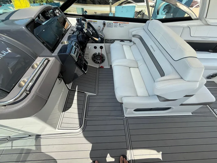  Yacht Photos Pics 2023 Formula 350 Crossover Bowrider I/O interior with sleek helm and luxurious seating.