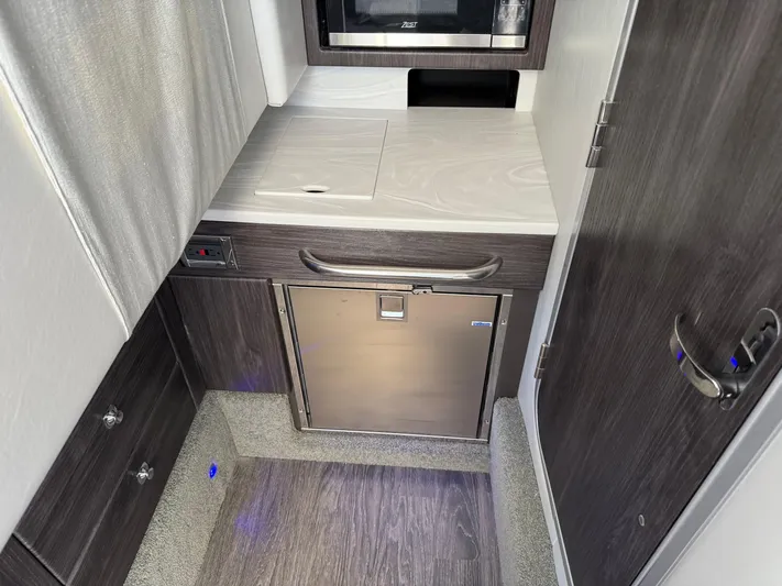  Yacht Photos Pics 2023 Formula 350 Crossover Bowrider I/O interior kitchenette with modern appliances and sleek design.