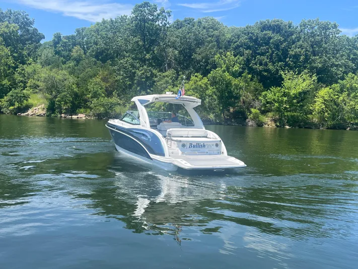  Yacht Photos Pics 2023 Formula 350 Crossover Bowrider I/O cruising on a scenic lake.