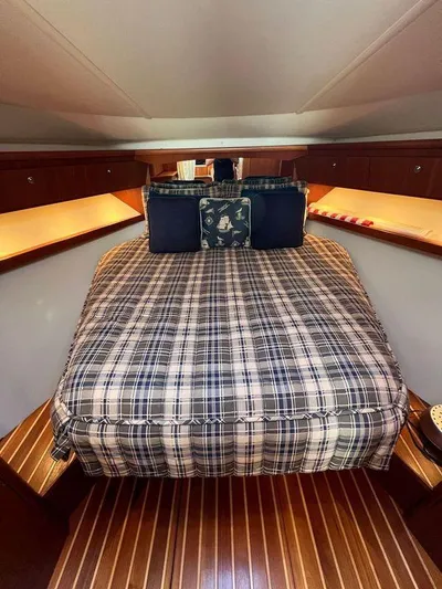 Audacious Yacht Photos Pics 2008 Tiara Yachts 4200 Open cabin with plaid bedding and wooden flooring.