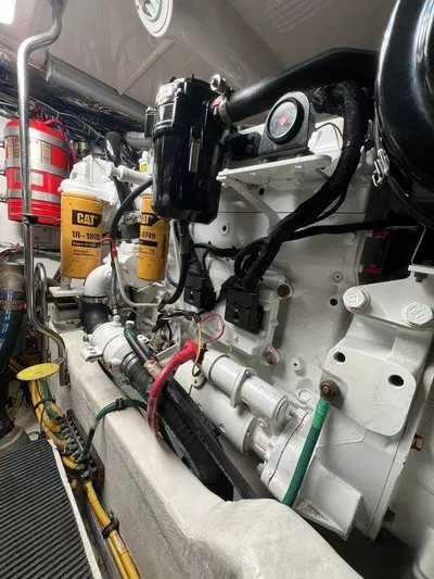 Audacious Yacht Photos Pics Engine room of 2008 Tiara Yachts 4200 Open, featuring CAT components and fire extinguishers.