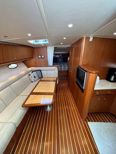 Audacious Yacht Photos Pics 2008 Tiara Yachts 4200 Open interior with elegant wood finish and cozy seating area.