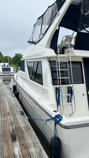  Yacht Photos Pics 1999 Bayliner 3988 Motoryacht docked, featuring sleek design and modern amenities.