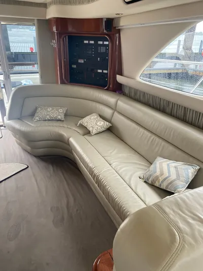 Yacht Photos Pics Luxurious interior of a 2002 Sea Ray 56 Sedan Bridge yacht with plush seating.