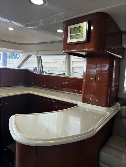  Yacht Photos Pics Luxurious interior of 2002 Sea Ray 56 Sedan Bridge yacht with elegant wood cabinetry.