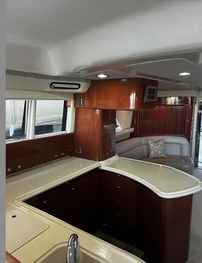  Yacht Photos Pics Interior of 2002 Sea Ray 56 Sedan Bridge yacht with elegant wood cabinetry and modern design.