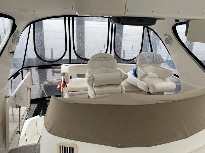  Yacht Photos Pics 2002 Sea Ray 56 Sedan Bridge interior with helm and seating area.