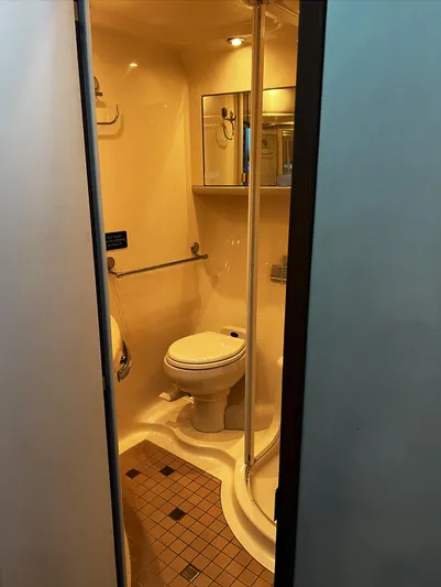  Yacht Photos Pics Compact bathroom in 2002 Sea Ray 56 Sedan Bridge yacht with shower and toilet.