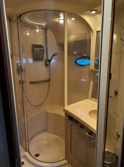  Yacht Photos Pics Luxurious bathroom in 2002 Sea Ray 56 Sedan Bridge yacht with modern shower and vanity.