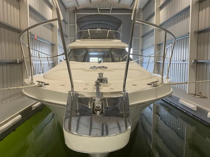  Yacht Photos Pics 2007 Ocean Alexander 54V yacht docked in a covered marina.