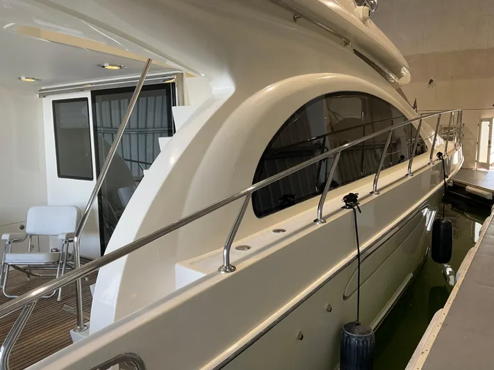  Yacht Photos Pics 2007 Ocean Alexander 54V yacht docked indoors, showcasing sleek design and spacious deck area.