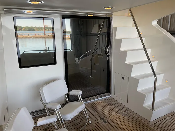 Yacht Photos Pics Luxury yacht interior with seating, stairs, and glass door; Ocean Alexander 54V, 2007 model.