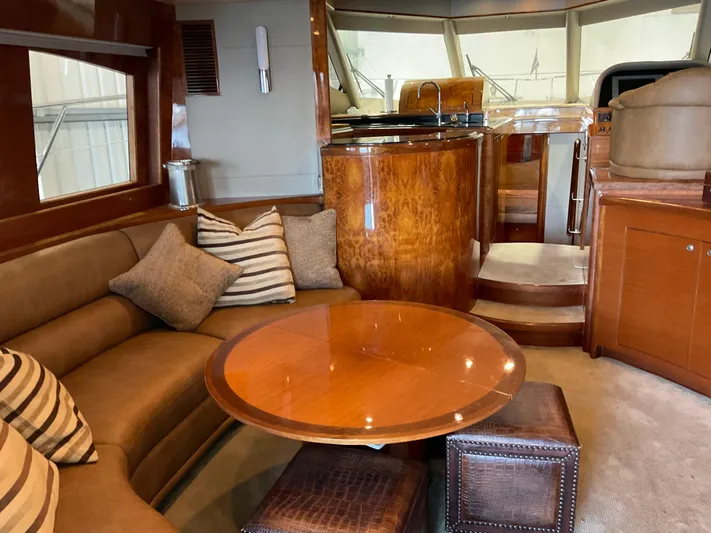  Yacht Photos Pics Luxurious interior of 2007 Ocean Alexander 54V yacht with elegant wood finishes and cozy seating.