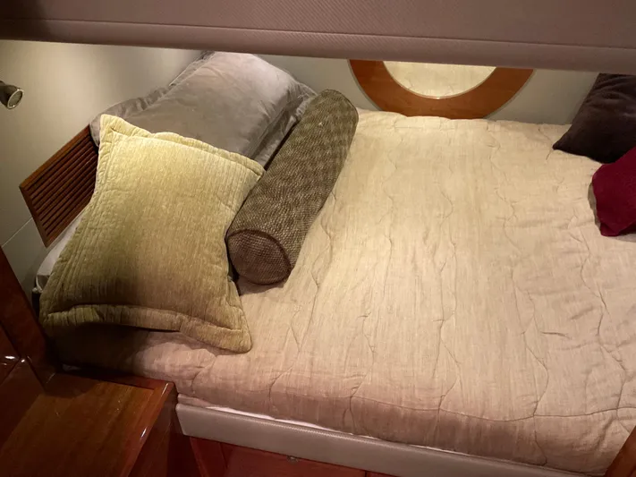  Yacht Photos Pics Luxurious bedroom interior of 2007 Ocean Alexander 54V yacht with cozy bedding and pillows.