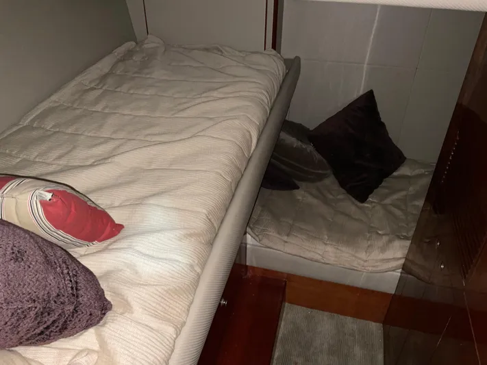  Yacht Photos Pics Cozy cabin interior of 2007 Ocean Alexander 54V yacht with comfortable bedding and pillows.