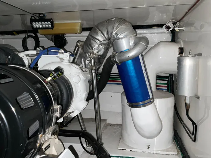  Yacht Photos Pics Engine room of 2007 Ocean Alexander 54V yacht, showcasing mechanical components and piping.