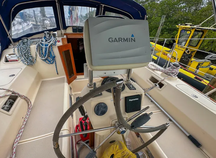 Three Dolphins Yacht Photos Pics Cockpit of 2005 Island Packet 370 sailboat with Garmin navigation system.