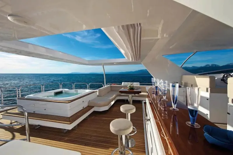  Yacht Photos Pics Luxurious Benetti Delfino 93 yacht deck with jacuzzi and bar, 2011 model.