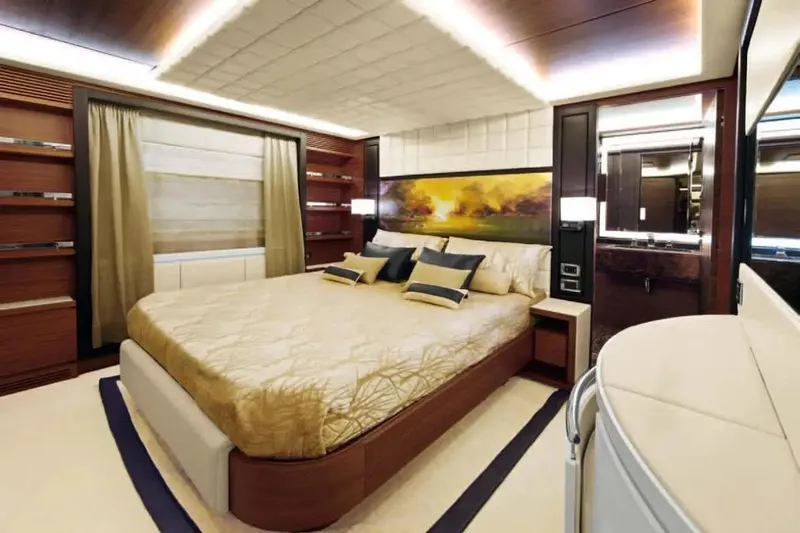  Yacht Photos Pics Luxurious bedroom interior on 2011 Benetti Delfino 93 yacht, featuring elegant decor and ambient lighting.