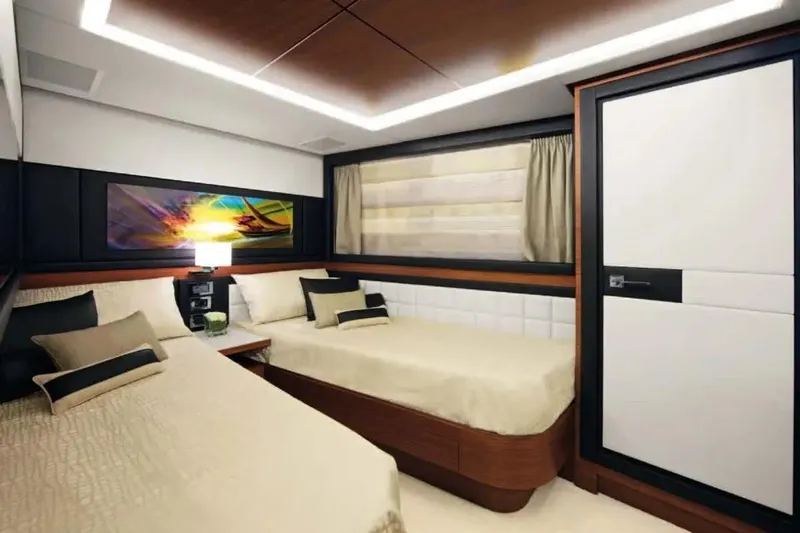  Yacht Photos Pics Luxurious cabin interior of 2011 Benetti Delfino 93 yacht with twin beds and modern decor.