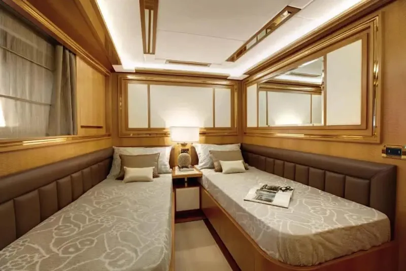  Yacht Photos Pics Luxurious twin cabin interior of 2011 Benetti Delfino 93 yacht, featuring elegant wood paneling.