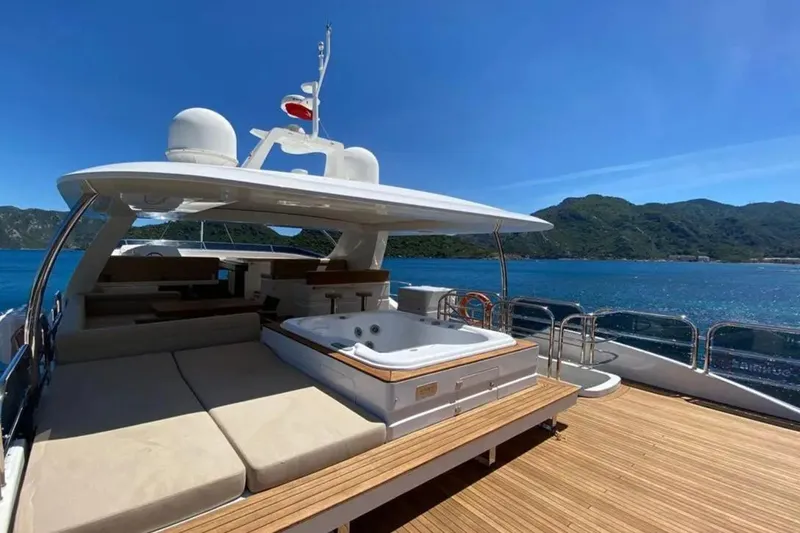  Yacht Photos Pics Luxurious Benetti Delfino 93 yacht deck with jacuzzi, 2011 model, scenic ocean view.