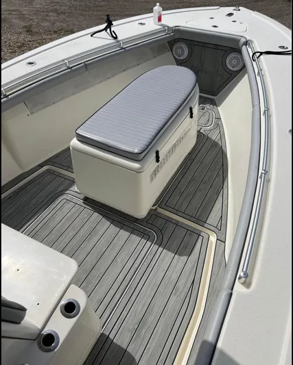  Yacht Photos Pics 2011 Yellowfin 29 Offshore boat interior with cushioned seating and non-slip flooring.