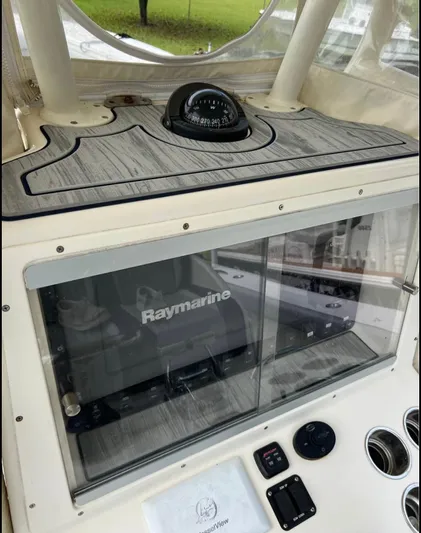  Yacht Photos Pics 2011 Yellowfin 29 Offshore boat dashboard with Raymarine navigation system.