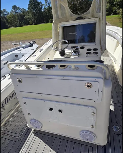  Yacht Photos Pics 2011 Yellowfin 29 Offshore boat console with navigation equipment and steering wheel.