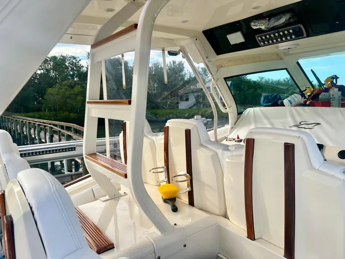  Yacht Photos Pics Interior of 2020 Scout 420 LXF boat with white seating and wooden accents.