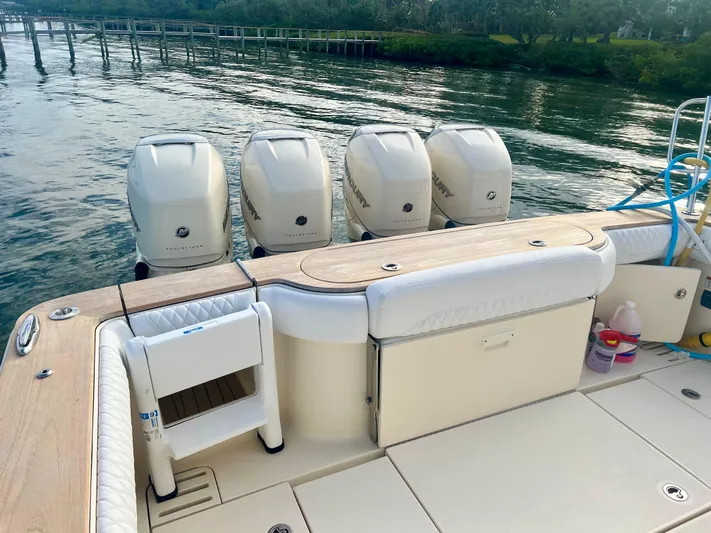  Yacht Photos Pics 2020 Scout 420 LXF boat with four powerful outboard engines on calm water.