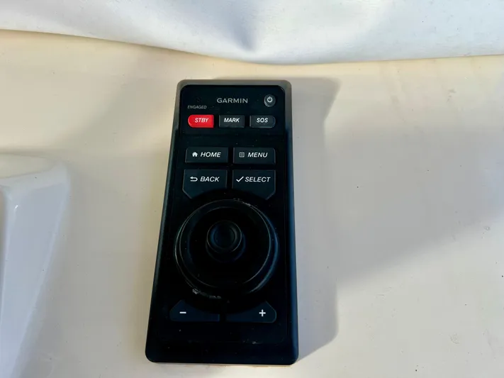  Yacht Photos Pics Garmin remote control for 2020 Scout 420 LXF boat, featuring navigation buttons.