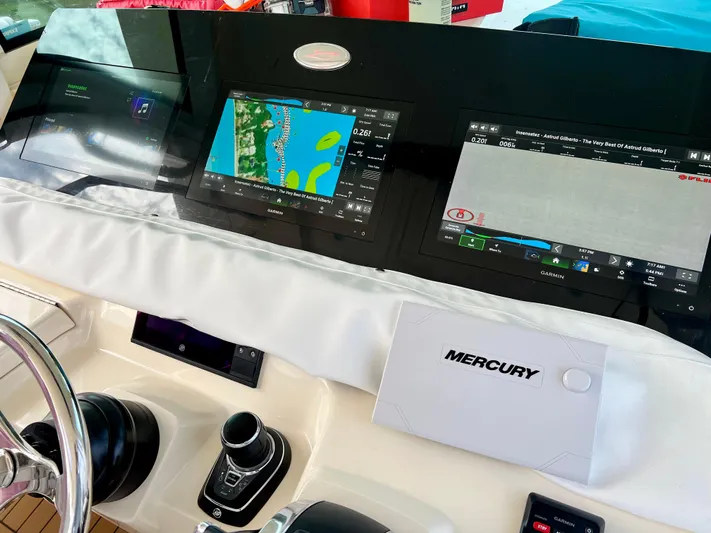  Yacht Photos Pics 2020 Scout 420 LXF boat dashboard with navigation screens and Mercury controls.