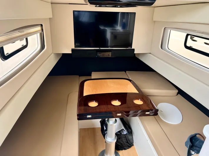  Yacht Photos Pics Luxurious interior of 2020 Scout 420 LXF yacht with TV and elegant seating area.