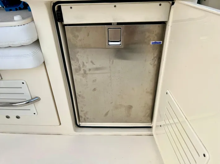  Yacht Photos Pics Stainless steel refrigerator on 2020 Scout 420 LXF boat interior.