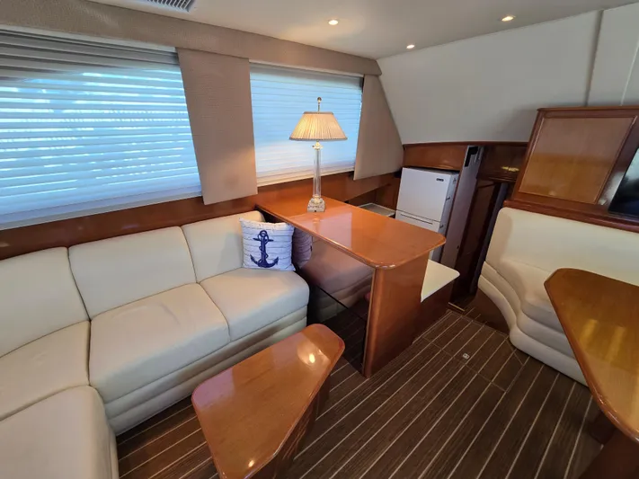  Yacht Photos Pics Interior of 2000 Post 47 Convertible yacht with cozy seating and elegant wood finishes.