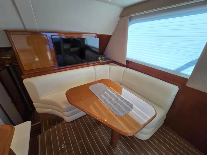  Yacht Photos Pics Luxurious interior of a 2000 Post 47 Convertible yacht with elegant seating and table.