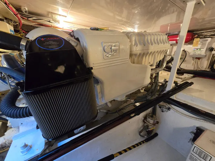  Yacht Photos Pics Engine room of a 2000 Post 47 Convertible boat, featuring a powerful marine engine.