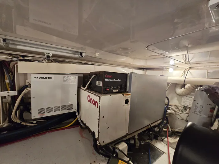  Yacht Photos Pics Engine room of a 2000 Post 47 Convertible with Onan Marine GenSet.