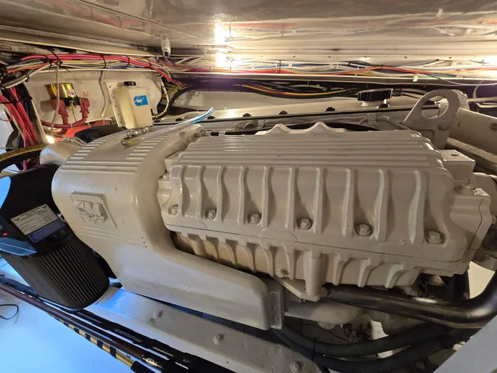  Yacht Photos Pics Engine compartment of a 2000 Post 47 Convertible boat, showcasing detailed mechanical components.