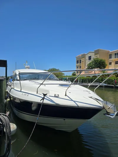  Yacht Photos Pics 2013 Fairline Targa 38 Open yacht docked in a marina under clear blue skies.